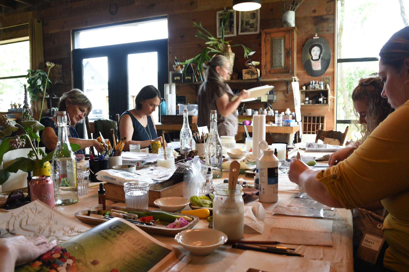 Artists at work in the studio at Hunter Moon Homestead