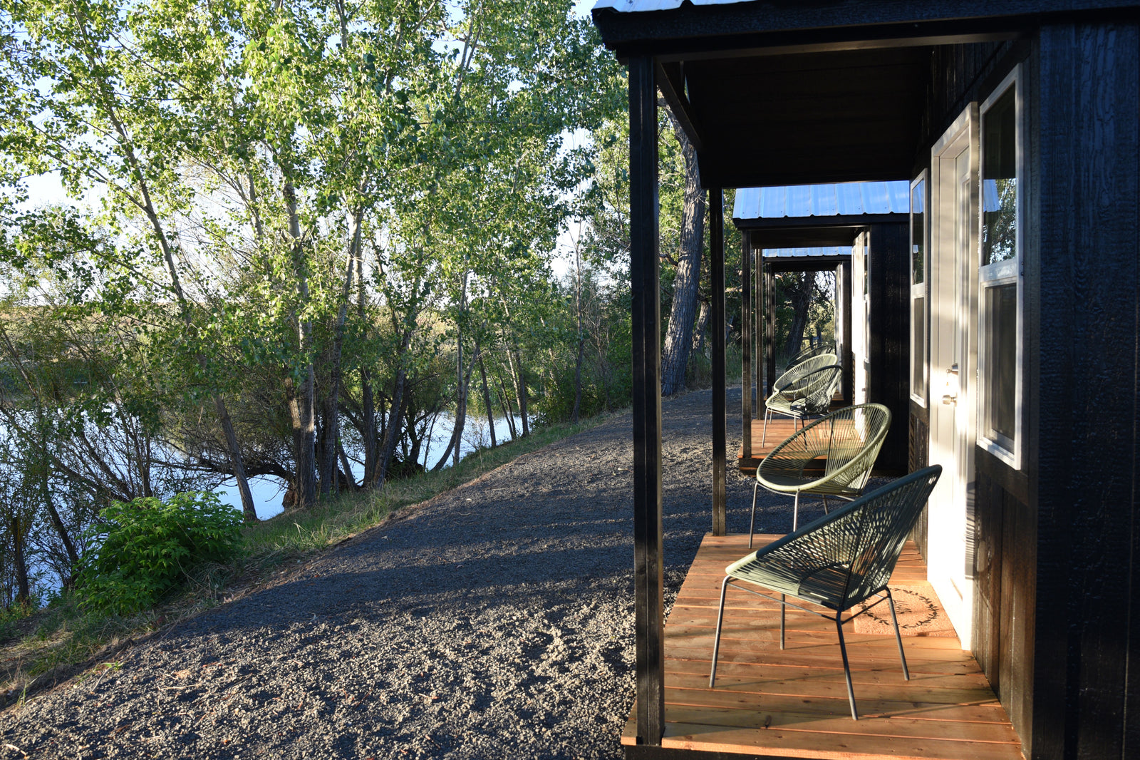 Private cabin patios by the pond at Hunter Moon Homestead