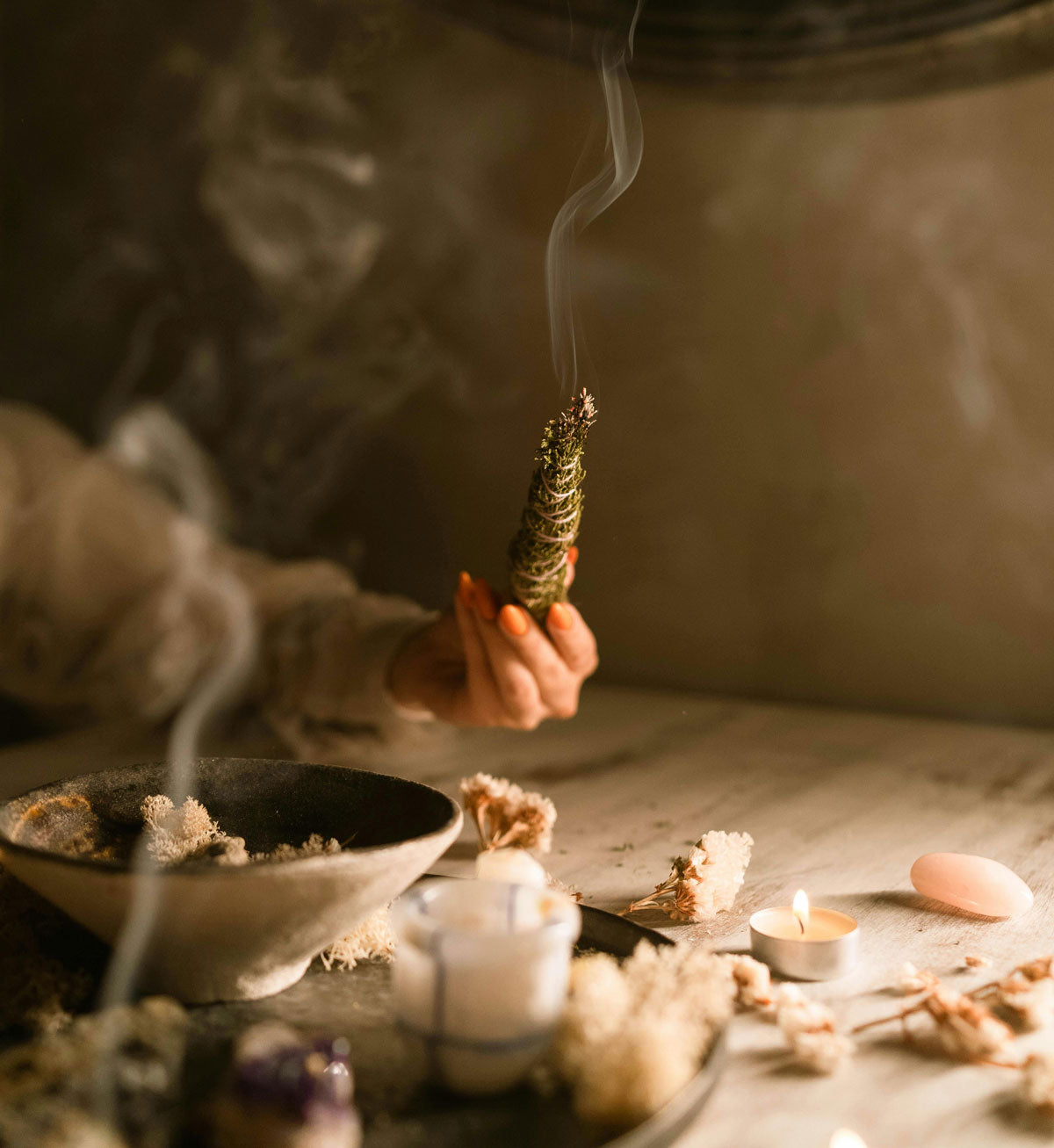 Photo of a ritual performed. Incense being lit and crystals. https://www.pexels.com/@anastasia-shuraeva/