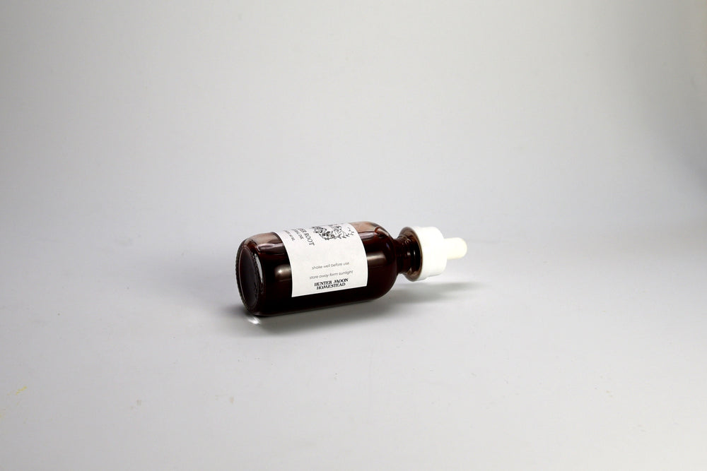 Brown glass dropper bottle of Madder root sumi ink